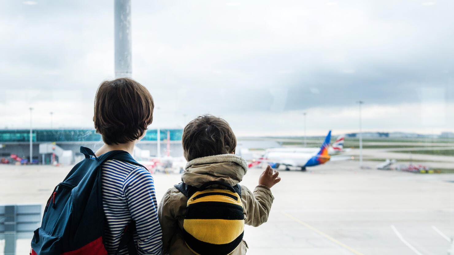 Brothers in airport departure lounge
