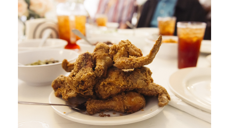 Pile of Crispy Southern fried chicken, on a family dining table