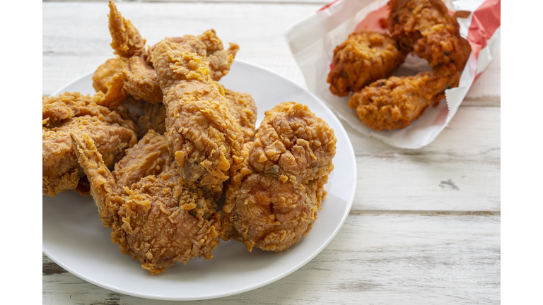 Fried chicken on a wooden floor.