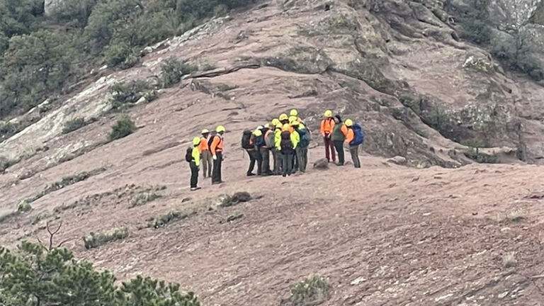 Rescue workers tend to a woman who missing for over a week at Big Bend National Park
