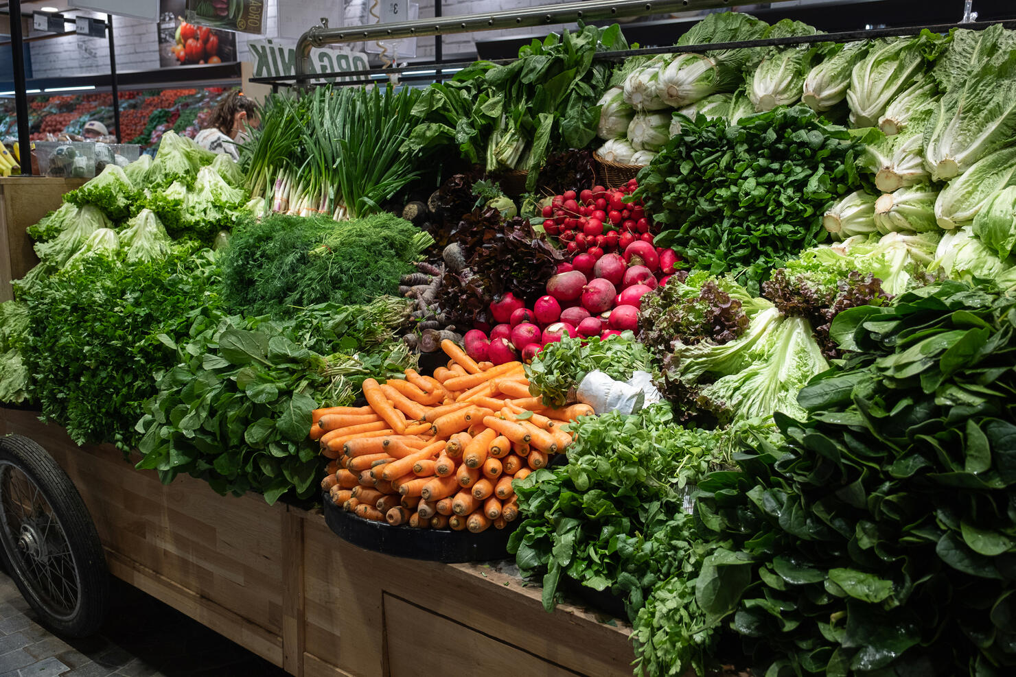 Green vegetables, lettuce leaves and food. The concept of healthy eating, vegetarianism and veganism. Fresh garden farm products grown in ecologically clean places. Vegetarian, vegan and raw food. Without genetically modified products. Market, retail.