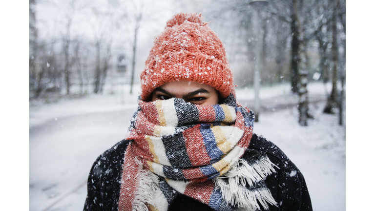 A young woman enjoying snowfall in Amsterdam