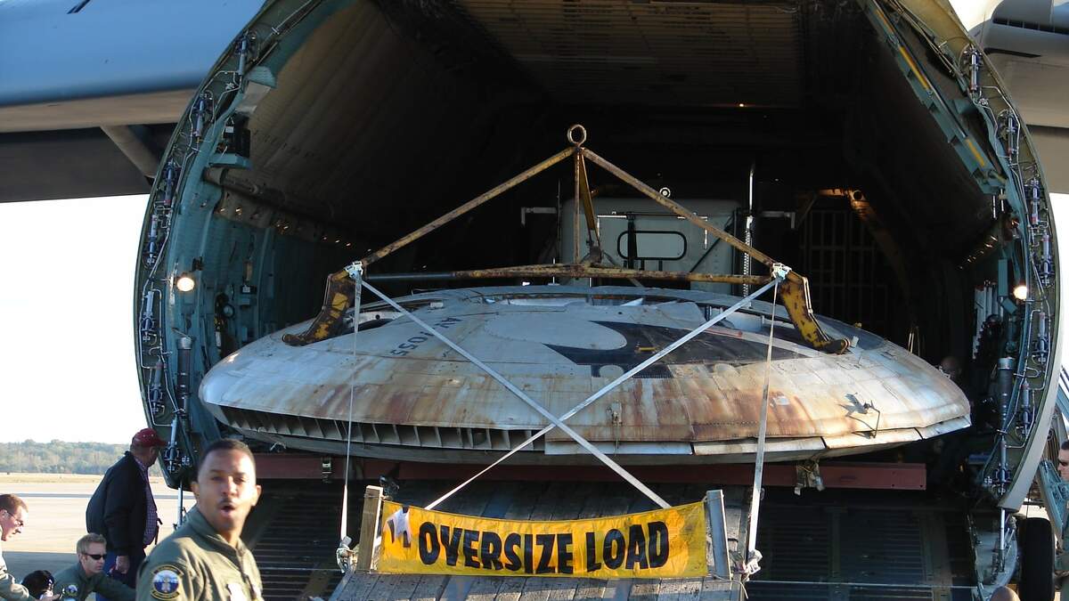 Air Force Shares Photos Of Flying Saucer Being Loaded Into Cargo Plane