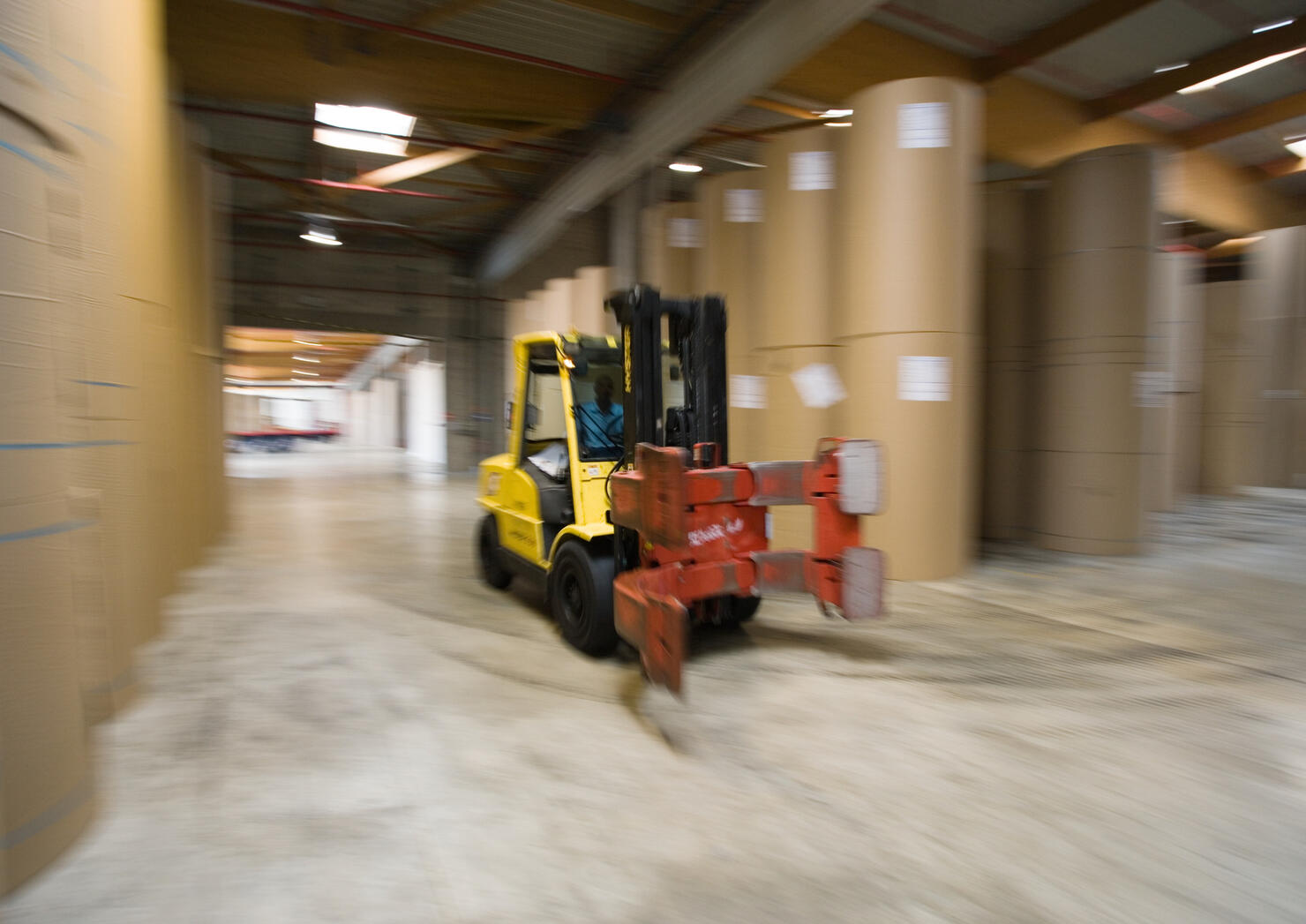Fork lift in paper mill stock area