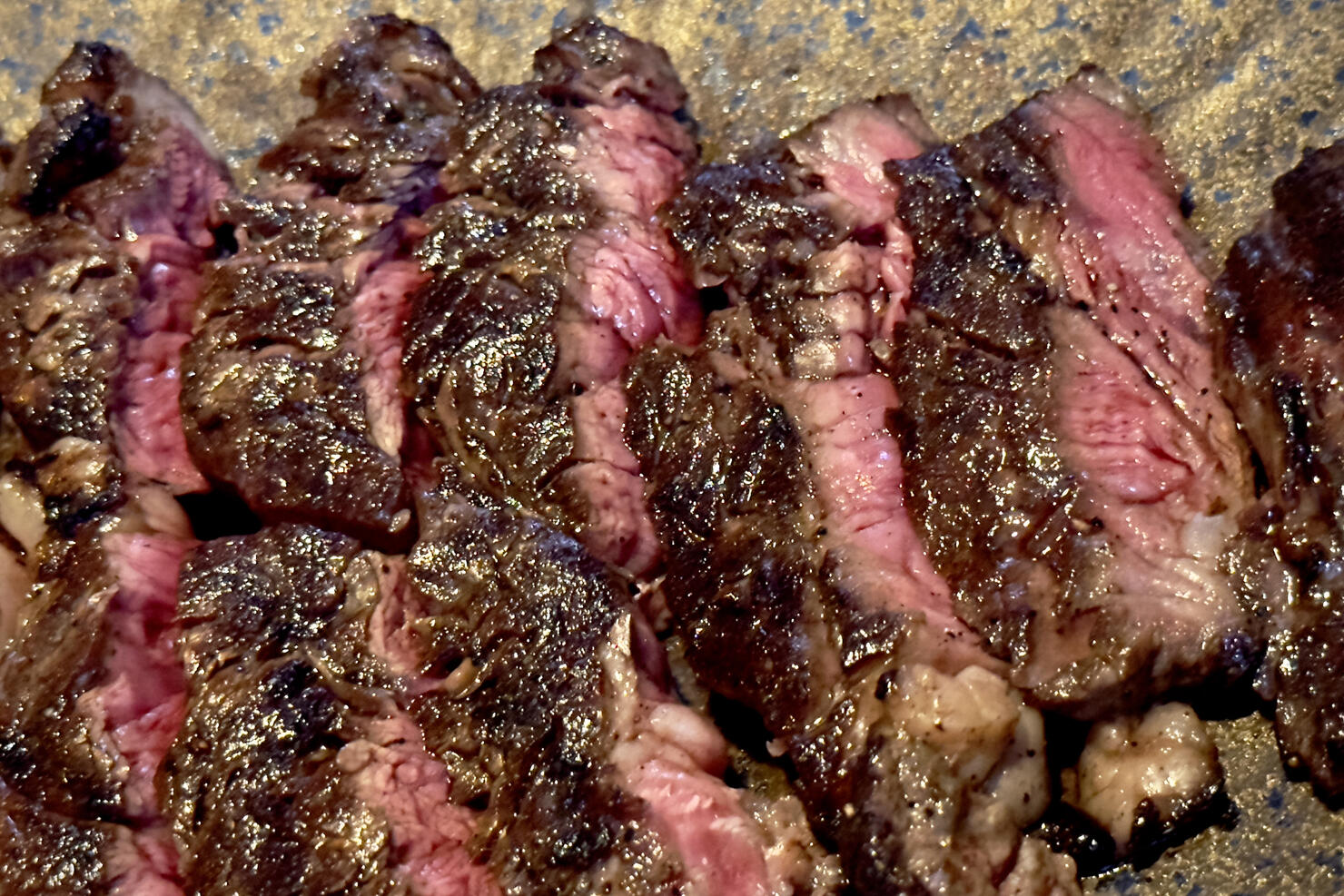 Closed up shot of medium rare grilled ribeye steak - Bangkok - Thailand