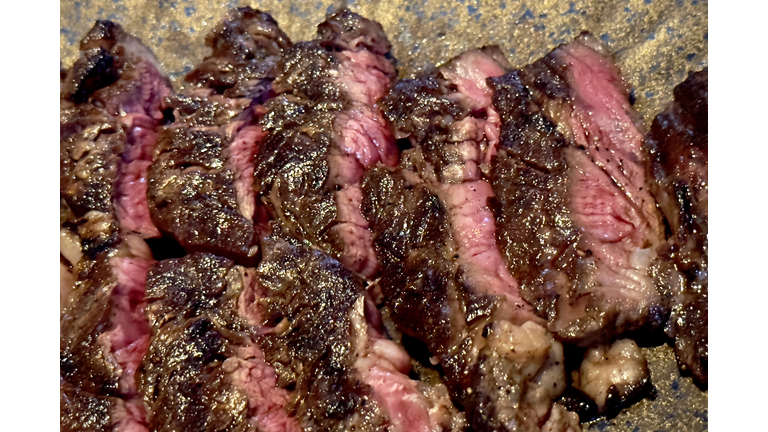 Closed up shot of medium rare grilled ribeye steak - Bangkok - Thailand