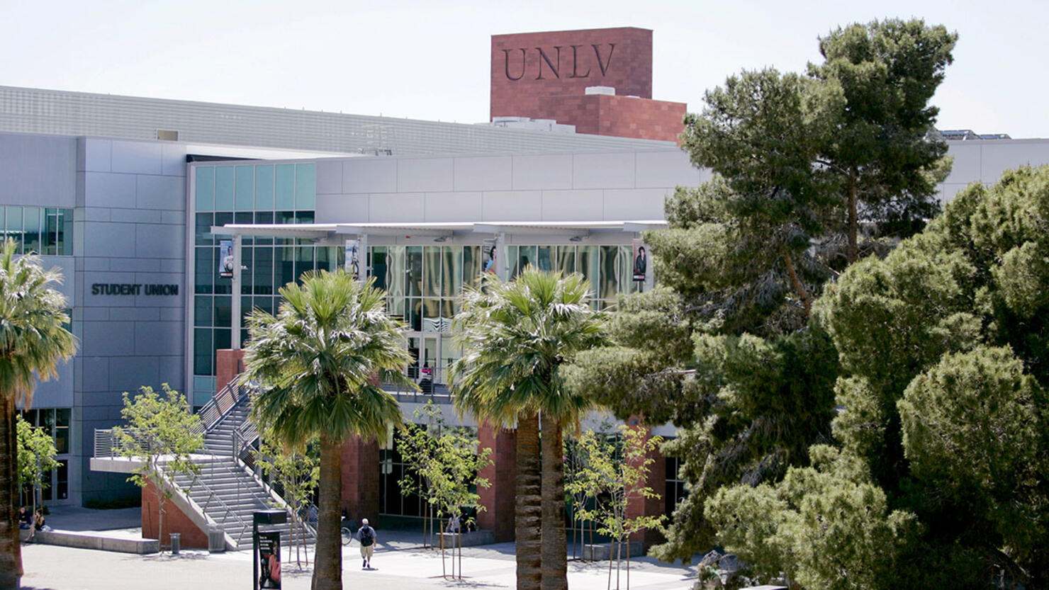 Students walk outside the Student Union on the University of