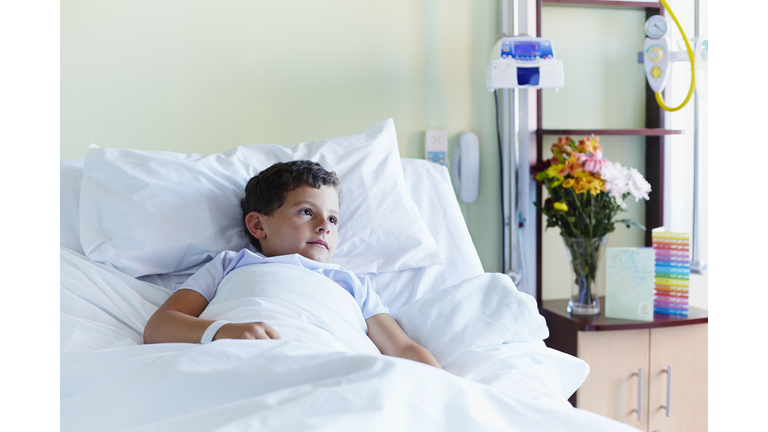 Thoughtful boy relaxing in hospital