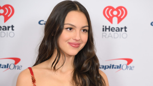 PHOTOS: Olivia Rodrigo Stuns In Vintage Versace At iHeartRadio Jingle Ball 