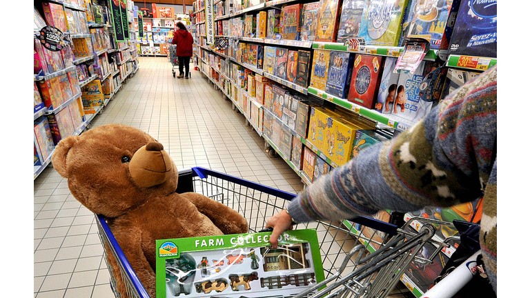 A customer buys toys as he shops in a su