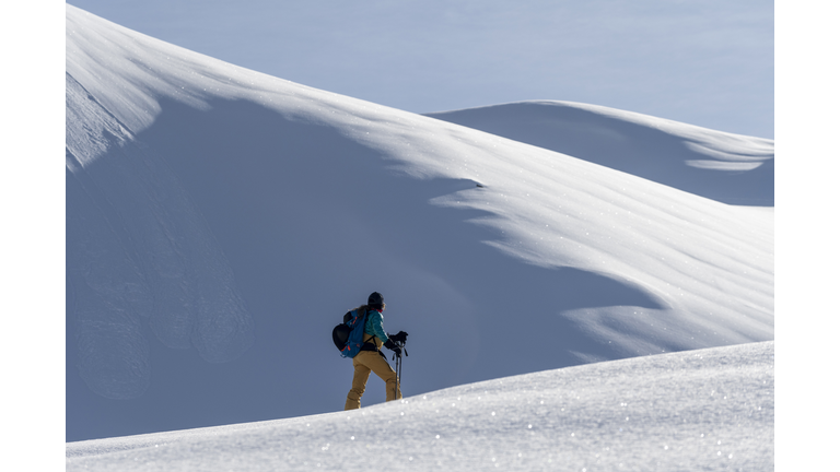 woman backcountry snowboarding
