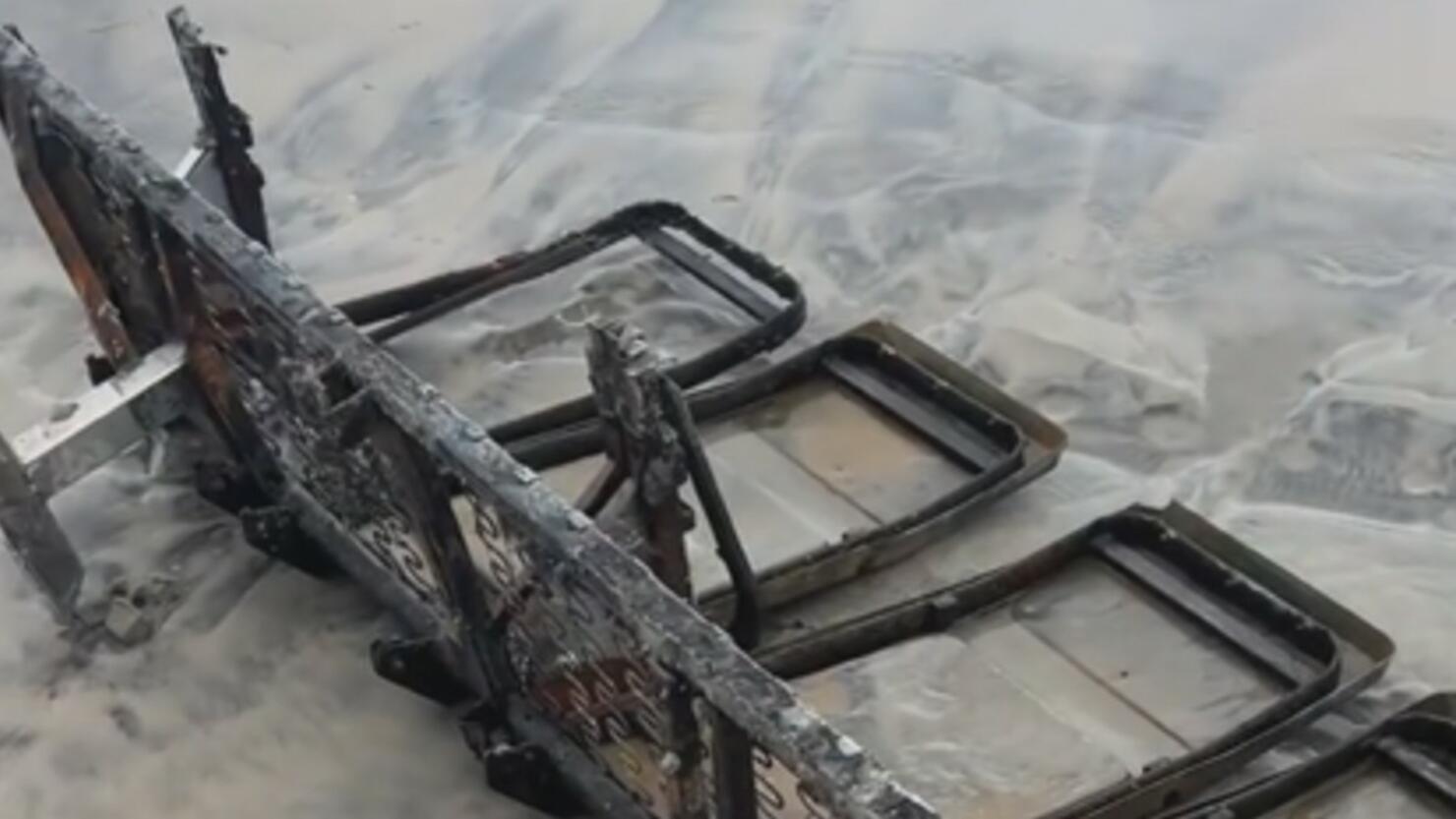 Rusted seats washed up on the beach