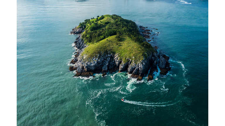 Overlooking a small motorboat heading for an island