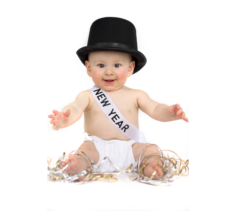 Baby dressed for new year on white background