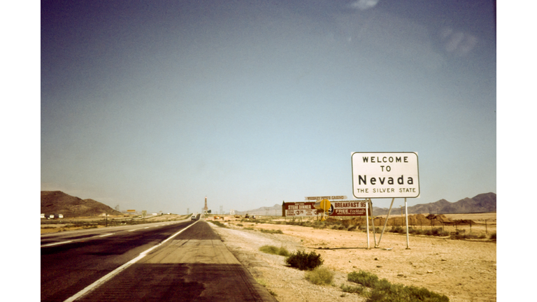 Sign board of 'welcome to Nevada' on road