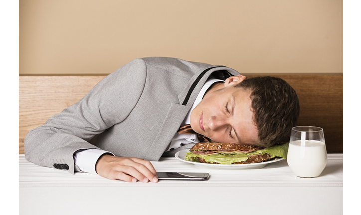 Boy sleeping on a sandwich