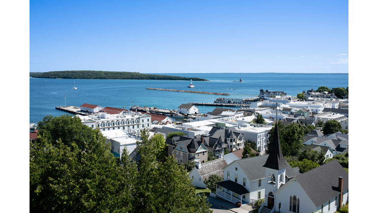 High angle view of townscape by sea against clear blue sky,Mackinac Island,Michigan,United States,USA