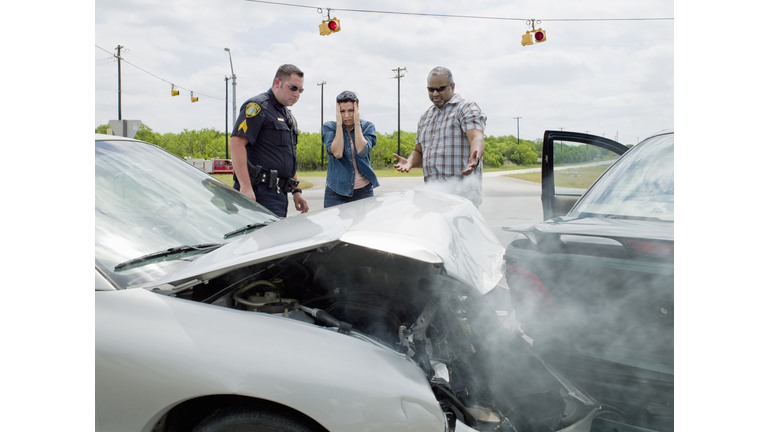 Police officer investigating at accident scene