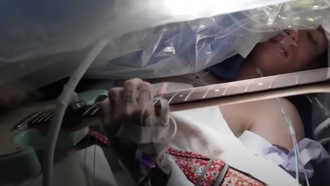 Watch A Man Play Guitar While Undergoing Brain Surgery