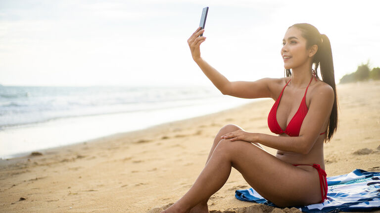 Women taking selfie on the beach