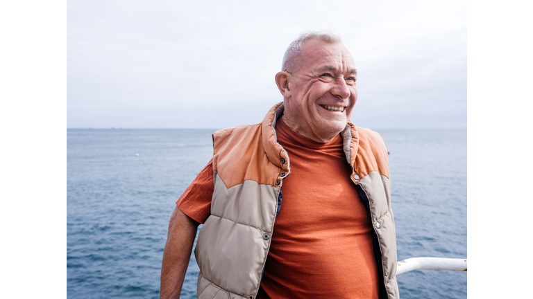 Seaside portrait of old man