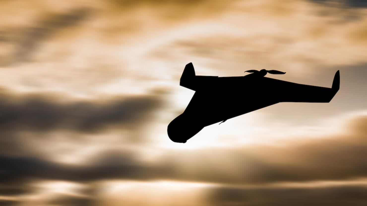 Iranian military unmanned aerial vehicle at sunset. Combat drone