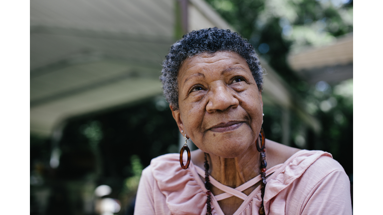 Close-up portrait of senior black woman looking thoughtful