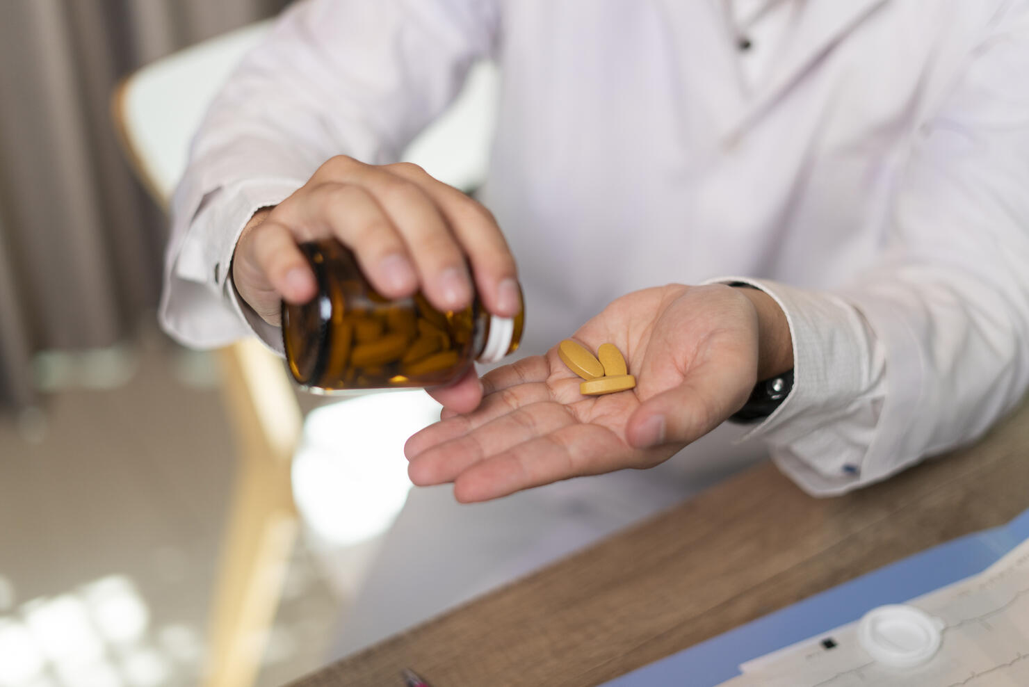 Man hand taking medicine