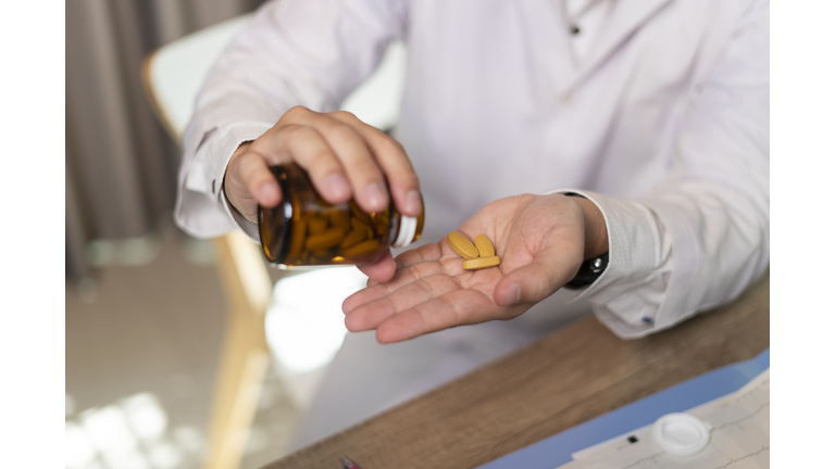 Man hand taking medicine