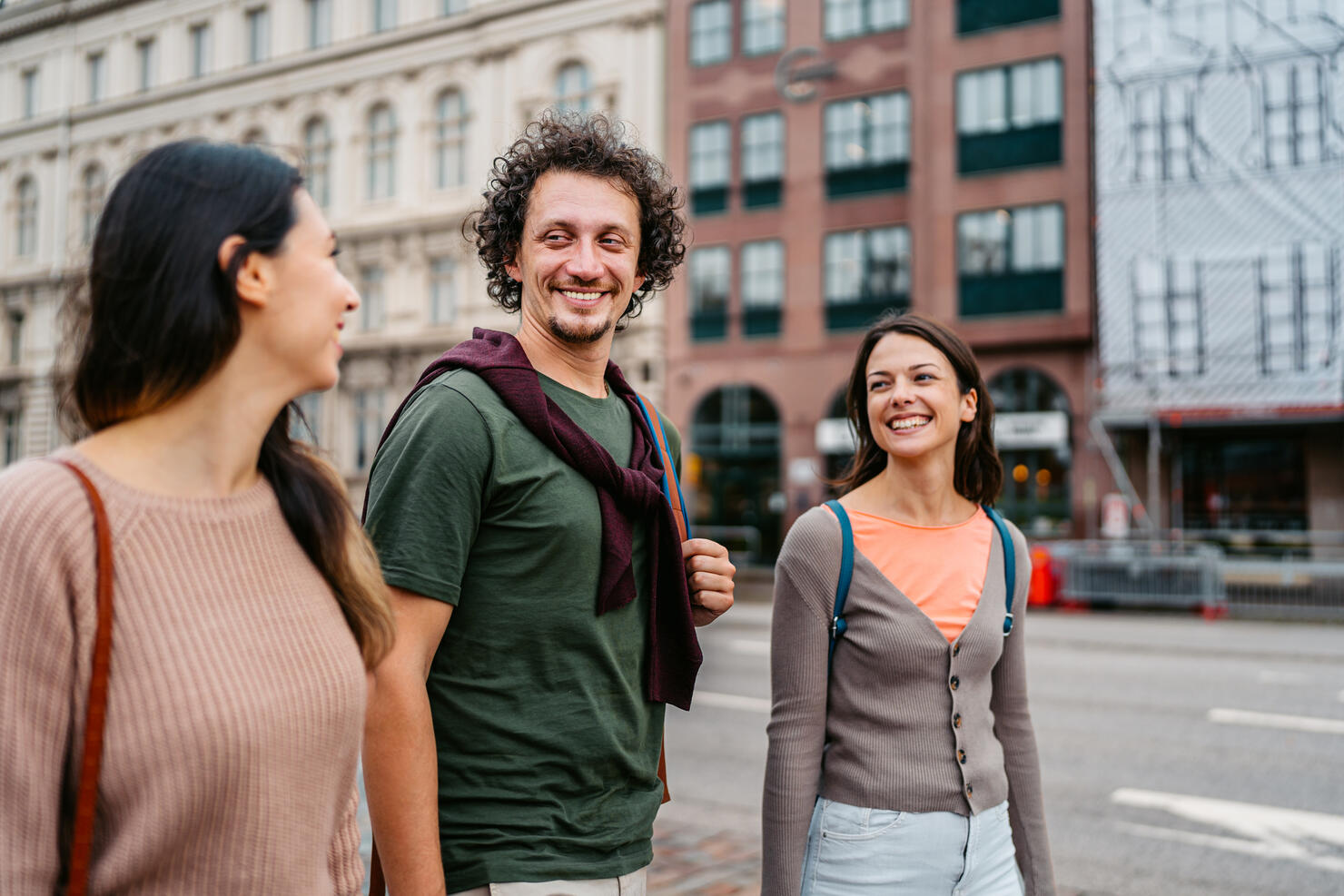 Three Young Friends Walking On The Street In Malmo In Sweden