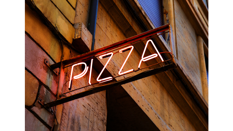 Old neon sign for pizza