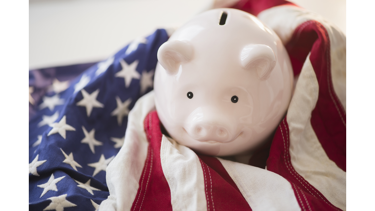 Close up of piggy bank and American flag