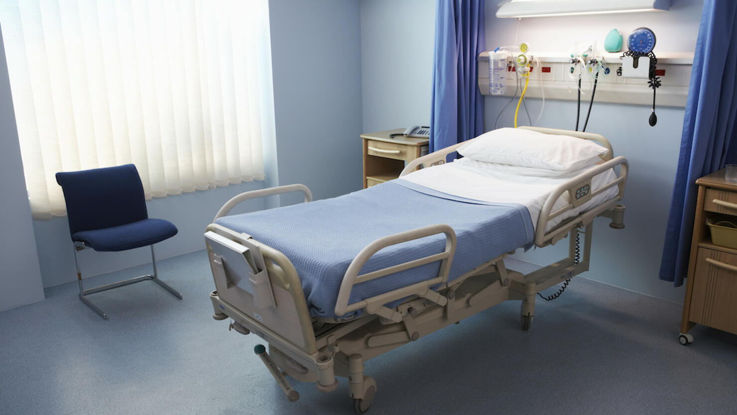 Empty Hospital Bed in a Ward