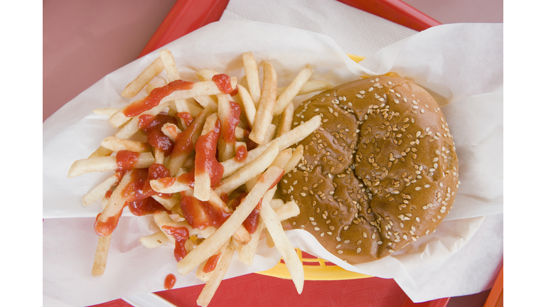 Hamburger and french fries on a fast food tray