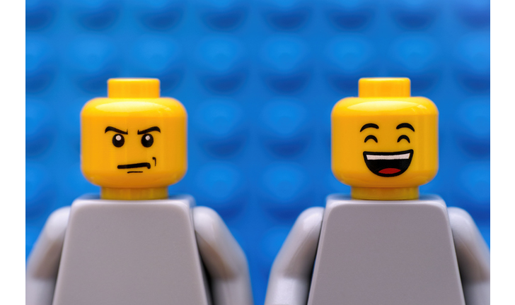 Two Lego minifigures - strict and happy