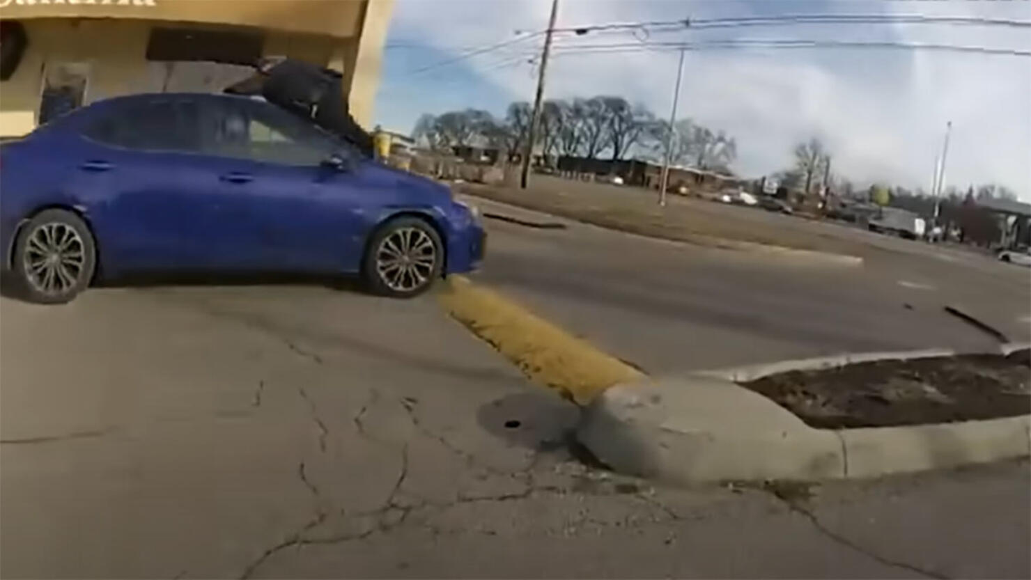 A police officer fires through the windshield of a car