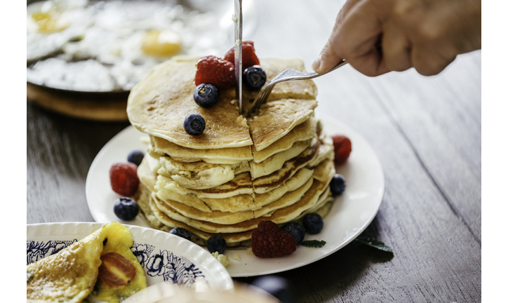 Stack of Pancakes with Maple Syrup and Fresh Berries