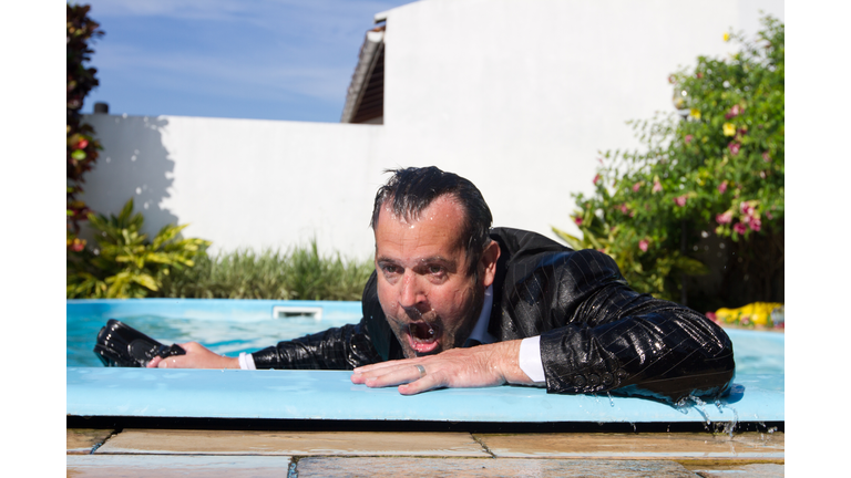 Soaking wet businessman