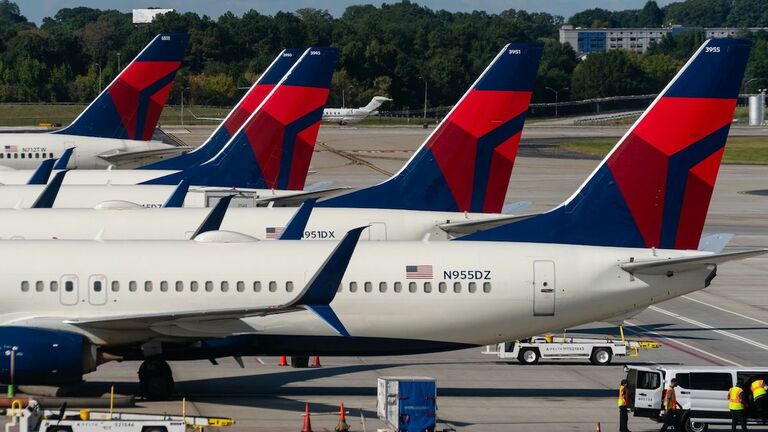 Travelers At HartsfieldJackson Atlanta International Airport As Congress Averts FAA Lapse With Stopgap Passage