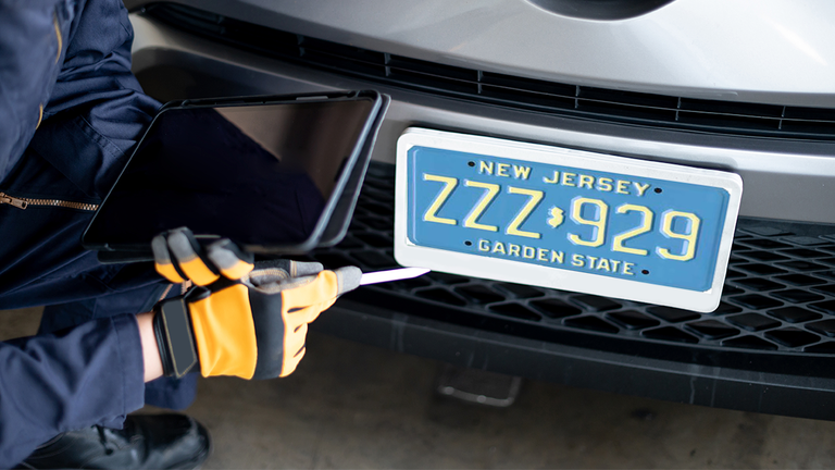 Blue New Jersey license plate on car