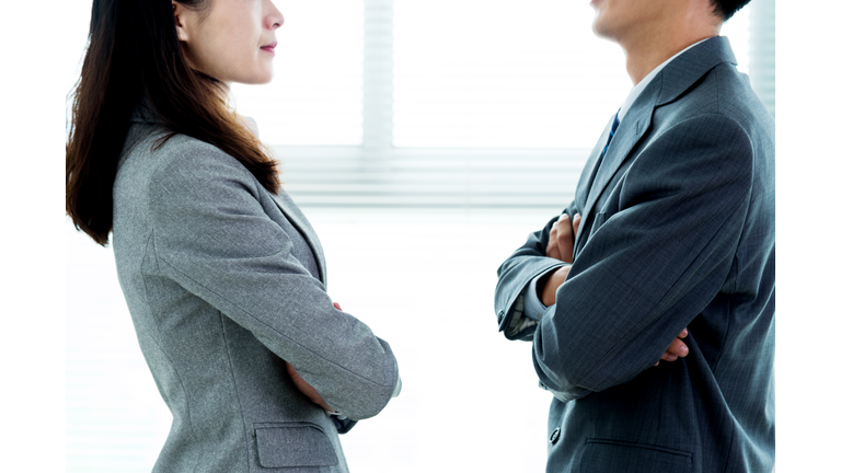 Two businesspeople standing face to face