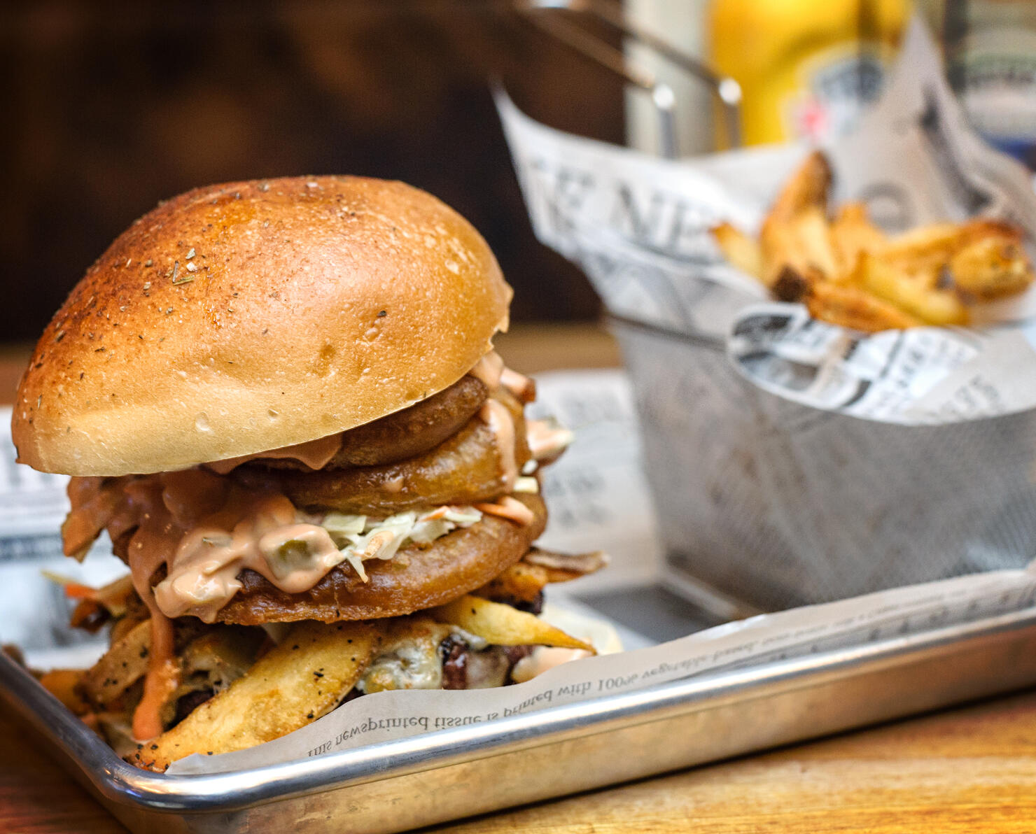 Huge Hamburger in Platter with Onion Rings and French Fries