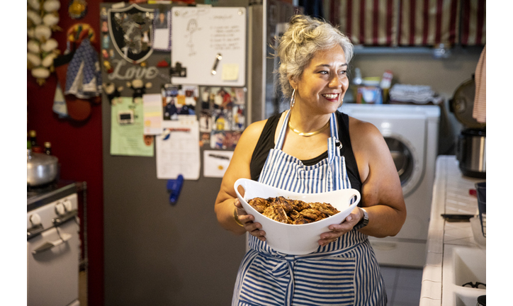 Hispanic Woman Making Dinner in Kitchen