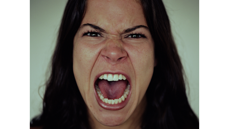 Young woman screaming, close-up