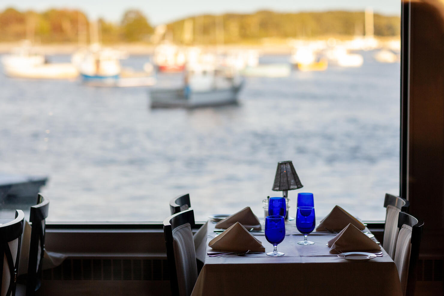 Blue glasses on a seaside table