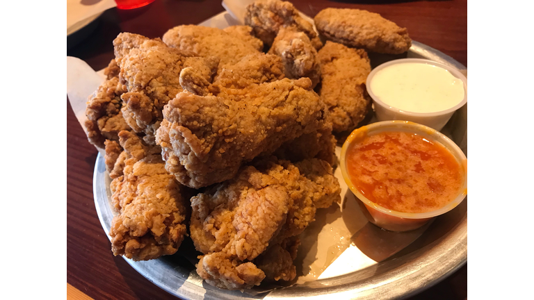 Plate of buffalo chicken wings with sauce
