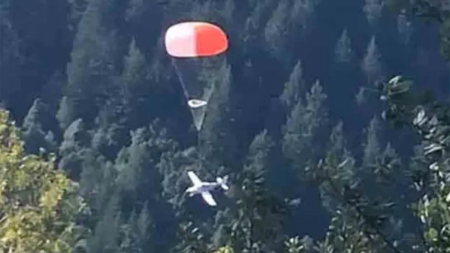 A single engine plane parachutes after a mechanical issue
