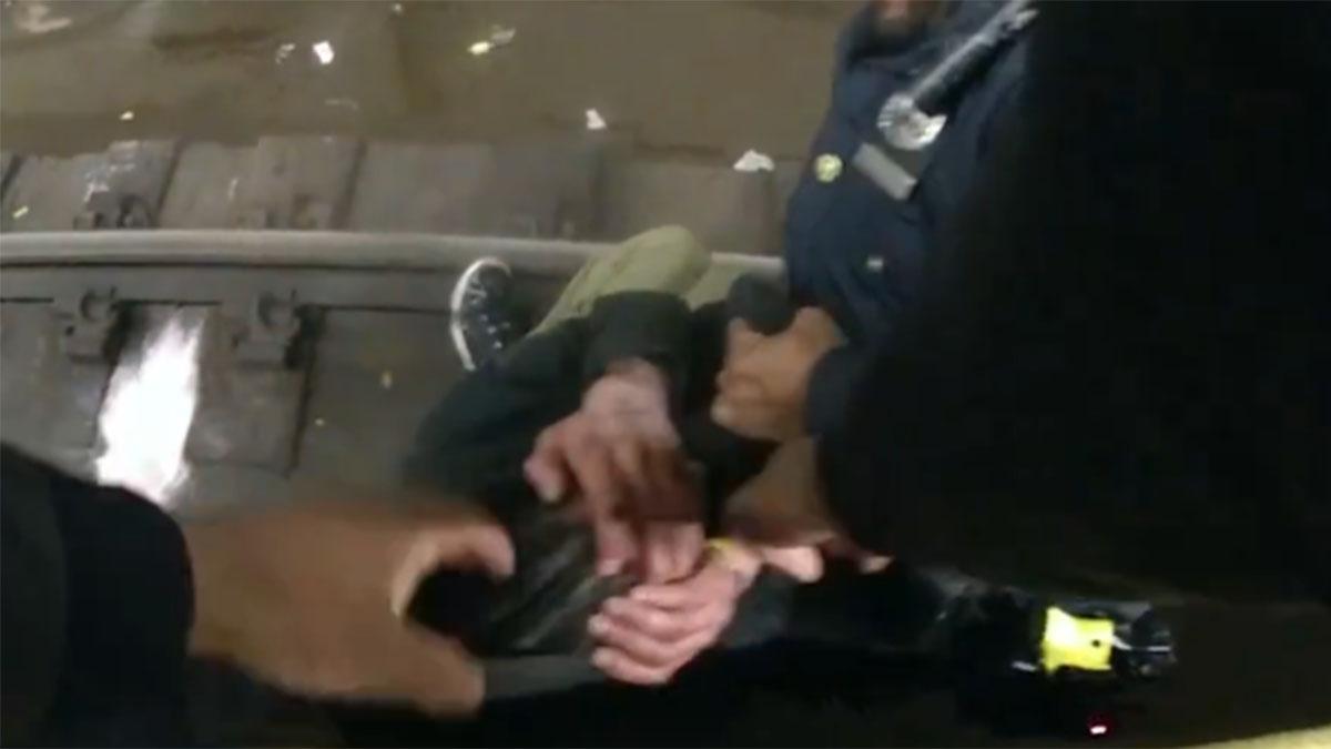 WATCH: Officers Pull Man Up From Subway Tracks By His Hoodie | iHeart