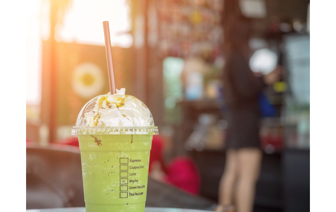 Fresh ice green tea in the plastic cup.