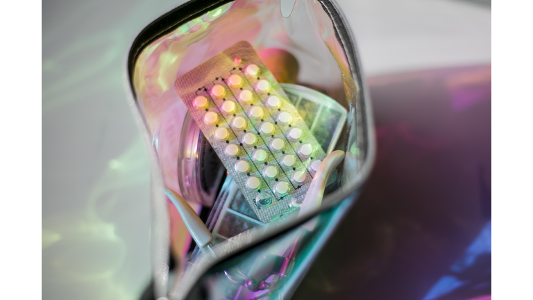 contraceptive pills in womans bag